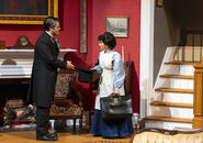 Dr. Sloper returns home and hands hat to the maid.