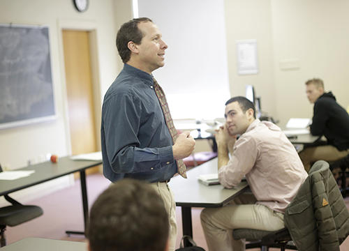 Victor Matheson, professor of economics, is seen here teaching a class at Holy Cross. Photo by Tom Rettig