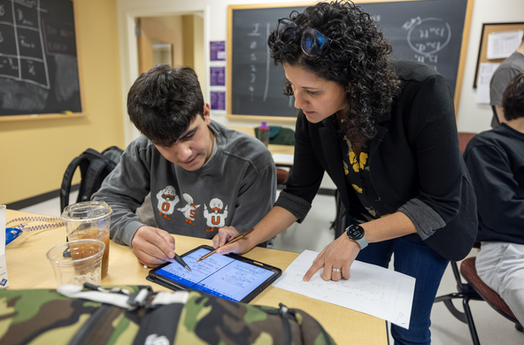 Professor Avila-Bront advising a student