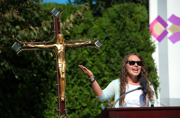 student at podium during Mass of the Holy Spirit 