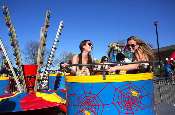 students taking a ride on an amusement park ride as part of Spring Weekend