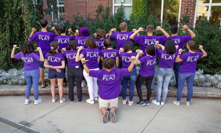 group of people facing their back