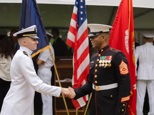 NROTC graduate and mentor at a special commencement reception