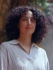 a woman in a collared shirt