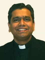 Jesuit priest in black shirt and collar