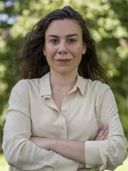 woman in a white button down shirt