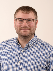 man in a blue checkered collared shirt