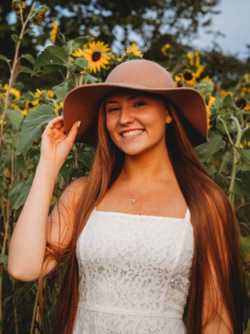 young woman in a field of flowers