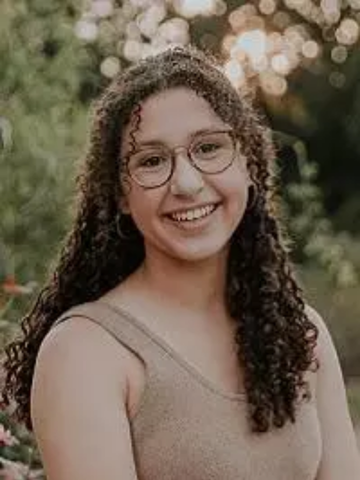 young woman with brown hair and glasses