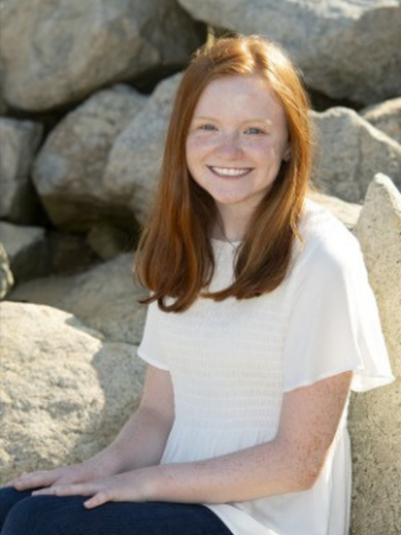 a young woman wearing a white shirt