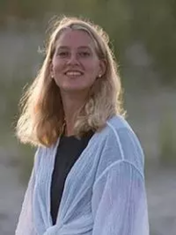 a young woman in a white shirt