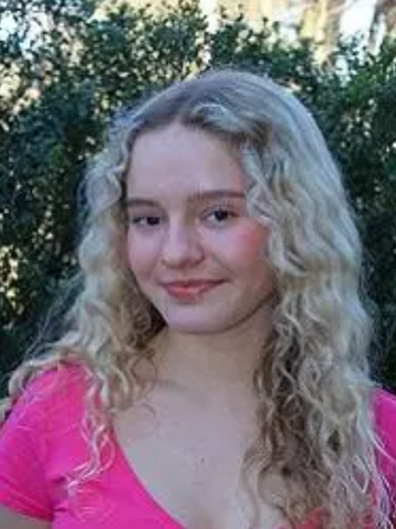 a young woman in a pink shirt