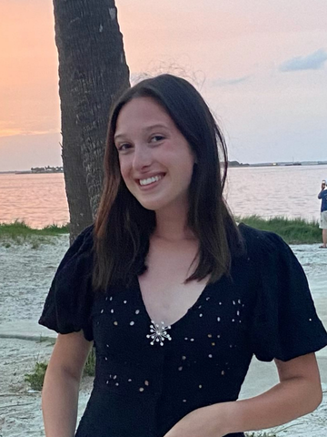 a young woman in a black dress