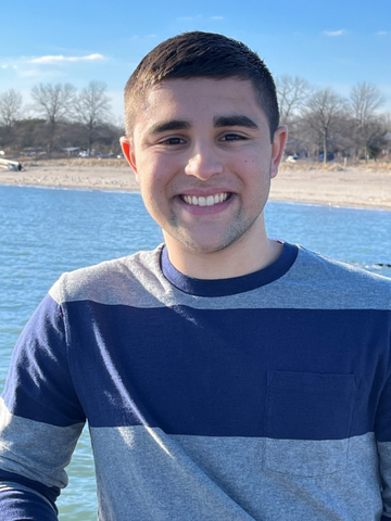 a young man in a blue striped sweater