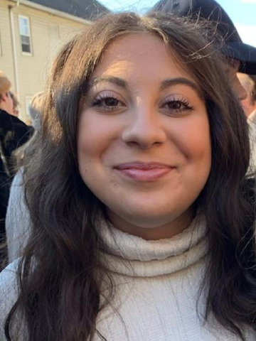 young woman in a white sweater