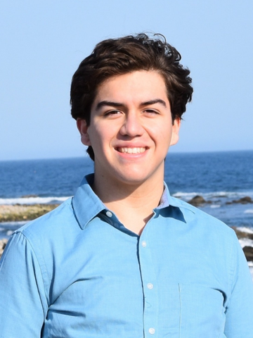 a young man in a blue button down shirt