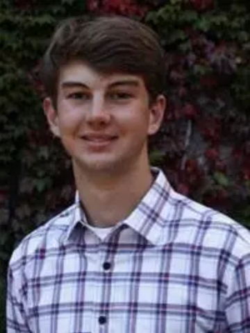 young man in a checkered collared shirt