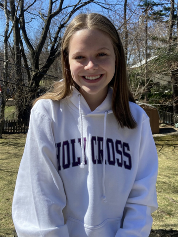 a young woman in a Holy Cross sweatshirt