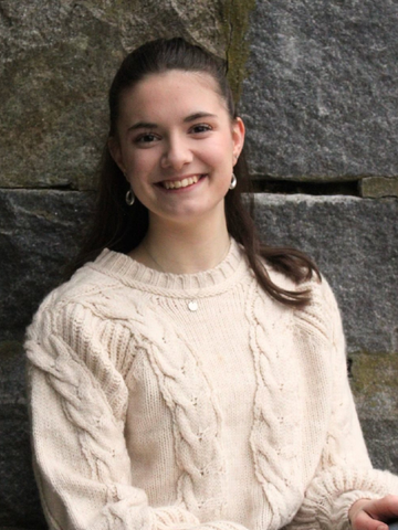 young woman in a white sweater