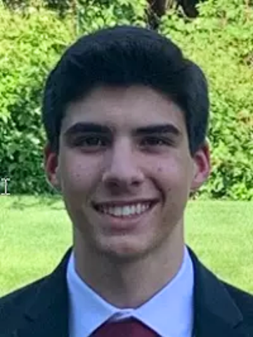 a young man in a tie and blazer