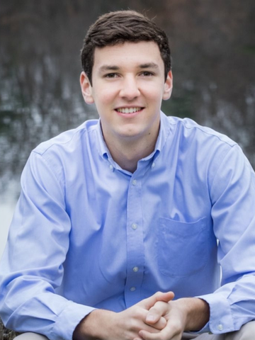 a young man in a blue button down shirt