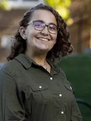 a young woman in a green shirt