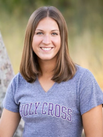 a young woman in a Holy Cross shirt