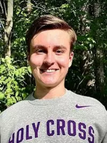 a young man in a Holy Cross shirt