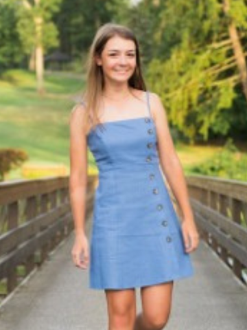 a young woman in a blue dress