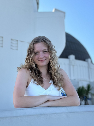 a young woman in a white shirt