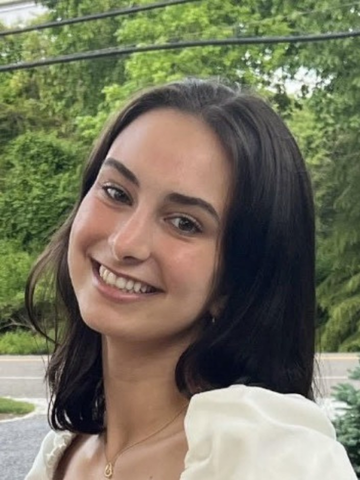 a young woman smiling at the camera