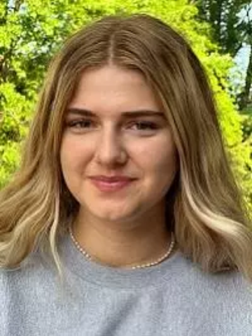 a young woman in a grey sweatshirt