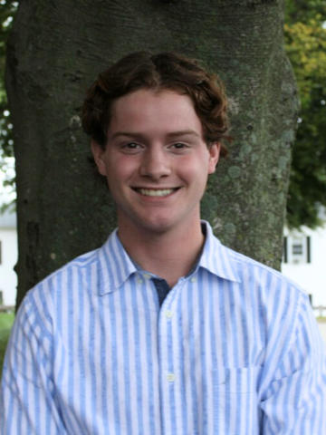 a young man in a blue button down shirt