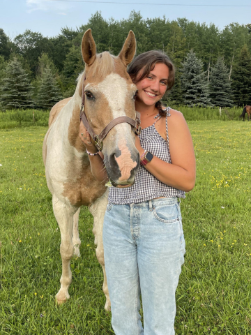 a young woman and a horse