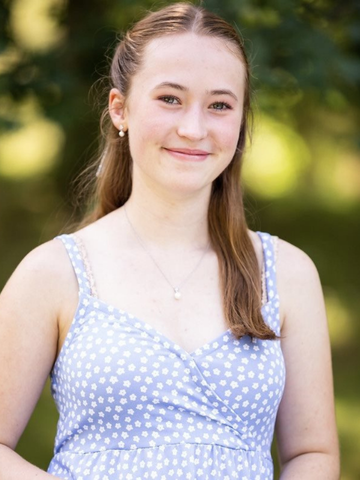 a young woman in a light blue dress