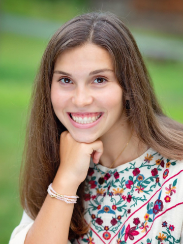 a young woman in a floral top