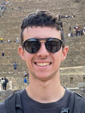 a young man wearing sun glasses