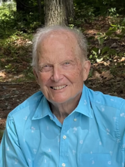 a man in a blue collared shirt