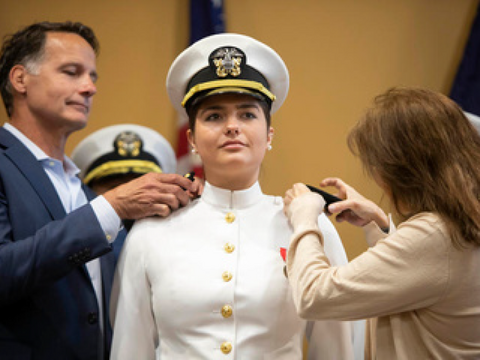 a woman in a naval uniform