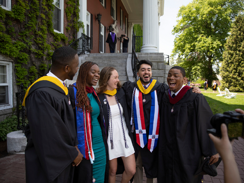 a group of graduates smiling