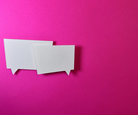 two speech bubbles on a pink background